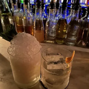 two cocktails on a bar counter
