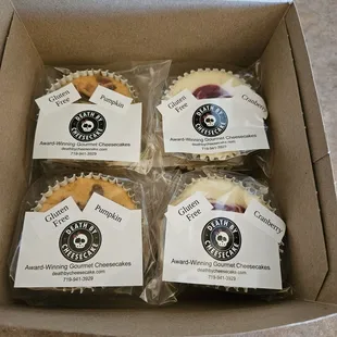 four cupcakes in a box