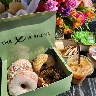 a box of doughnuts and drinks