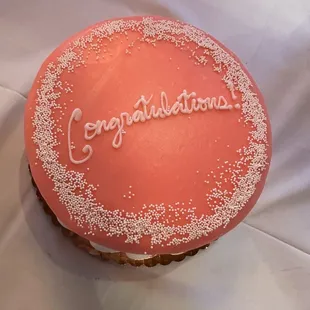 a cake with congratulations written on it