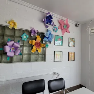 a wall of paper flowers