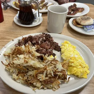 Corn beef and hash comes with eggs and toast. Added a side of hash browns to share.