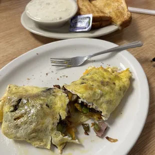 3 egg omelette with sausage, ham, onions, green peppers &amp; cheese, sausage gravy and toast.