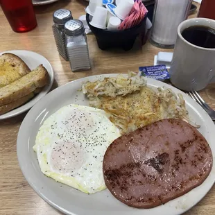 2 Eggs Over Easy, Hash Browns, Ham slice, Rye bread, coffee black
