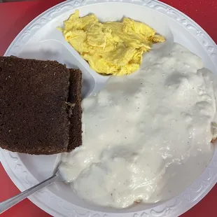 Scrambled eggs, gravy biscuit and liver mush