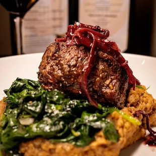 a plate of food and a glass of wine