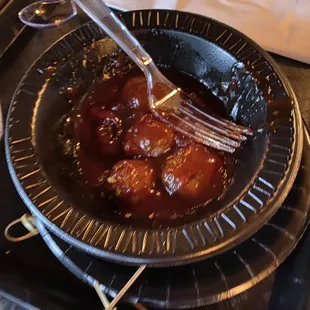 a plate of meatballs with a fork