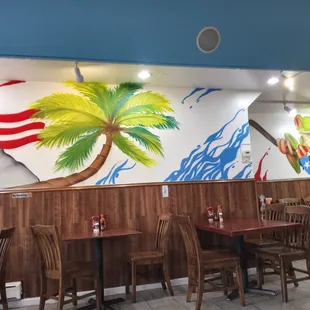 a dining area with tables and chairs