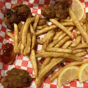 a basket of fried chicken and french fries
