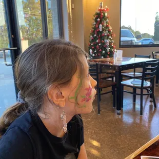 a little girl with face paint