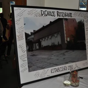 Signing the photo of our original building - 36 years ago!