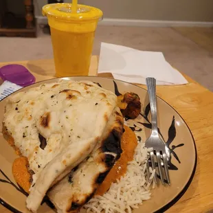 Garlic naan, butter chicken, rice, lassi