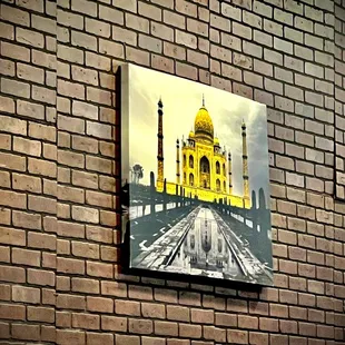 taj mahal on a brick wall