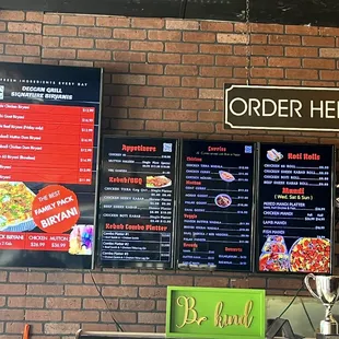 menus on a brick wall