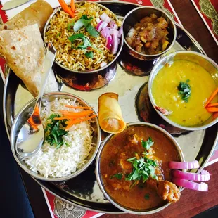 "Chicken Platter" served with Spring Roll, Roti, Andhra Chicken Curry, Yellow Dal curry, Vegetarian Biryani, Dessert.