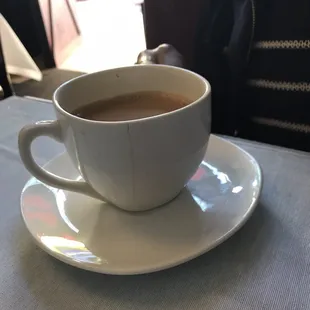 Cold chai in a cracked cup.