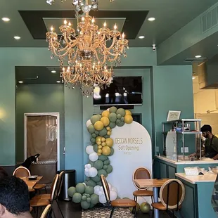 people sitting at tables in a restaurant