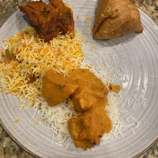 5 total pieces of butter chicken, here are 3 of them.  Missing naan bread, terrible rice.