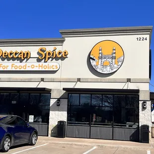 a car parked in front of the store