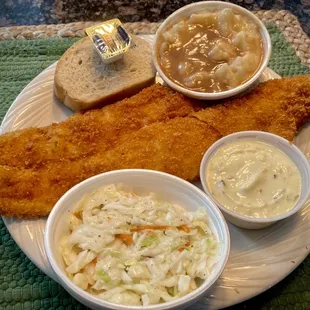 Panko coated fried fish dinner with real mashed potatoes, cole slaw and bread and butter.