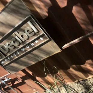 a sign for decibel coffee