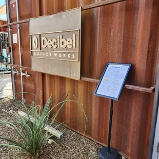 a sign for decibel coffee works