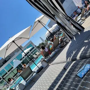 people lounging by the pool