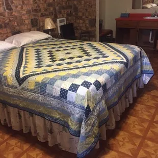 a bed with a quilt on it