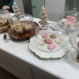 a woman standing in front of a counter