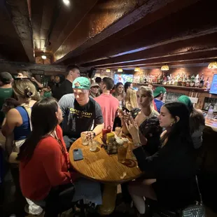 a group of people sitting around a table