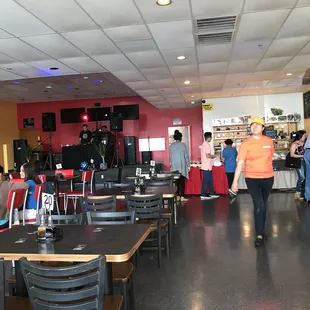 people walking through the restaurant