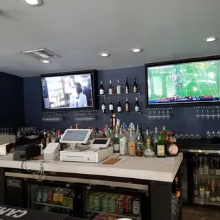 Spacious bar area with some really comfortable stools.