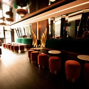 a row of stools and tables