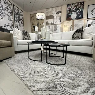 Rugs, furniture, art, lighting, vases, tables