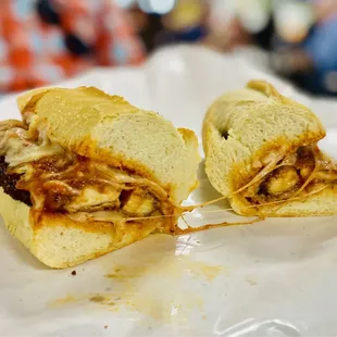 Inside the Chicken Parma, quality cheese. Nice cheese pull, perfectly cooked chicken savory sauce super fresh bread. Superb. OuiOui.