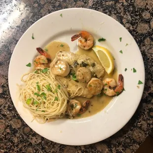a plate of pasta and shrimp