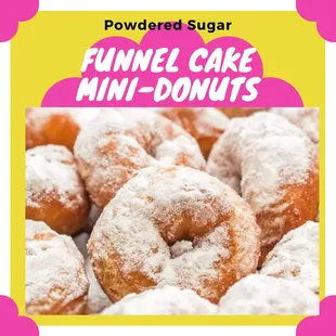 a pile of powdered sugar donuts