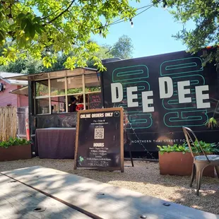 a food truck parked in front of a restaurant