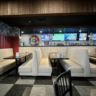 Distant view of bar and close-up booths