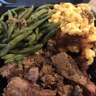 Brisket with garlic greens beans and baked truffle Mac and cheese