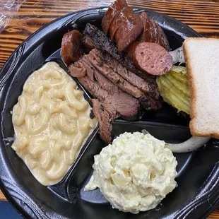 2 Meat Plate with brisket and sausage. Sides are Mac and Cheese and potato salad.