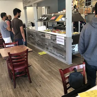 people standing in a restaurant