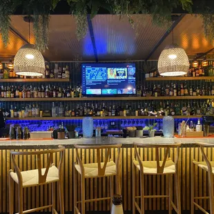 a bar with a television in the background