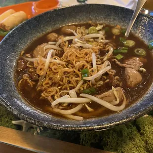 a bowl of noodles and meat