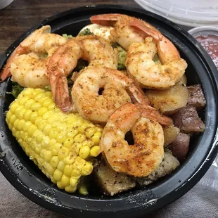 Cajun seasoned Shrimp bowl with corn on the cob, potatoes, broccoli, and shrimp! I substituted the sausage for extra potatoes.