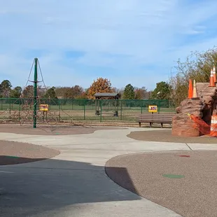 Spider climb and rock wall.  The dog park is next door, but the fences are not shared.