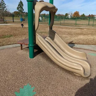 Slide you see when you first walk in.  Ground is nicely padded, clean, and has no tears.
