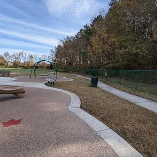 The walking path to show just how big this playground is.  Multiple trashcans, clean, and emptied.