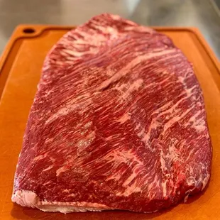 a piece of beef on a cutting board