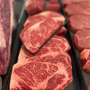 a variety of steaks on display